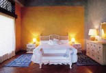 Raffles Canouan - Mezzanine Level Guest Room bed